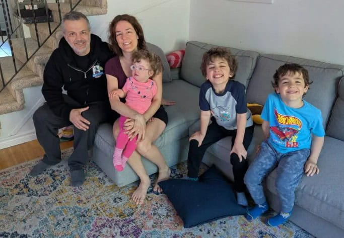 Back home with my husband and our three children after being discharged from the hospital following emergency brain surgery.